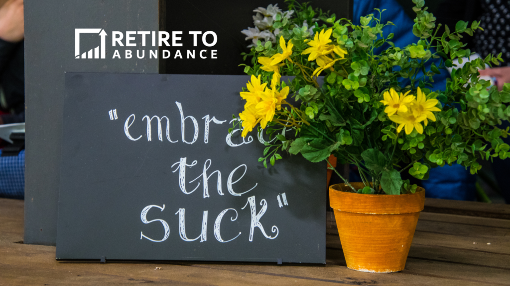 image of flowers and a sign that says embrace the suck